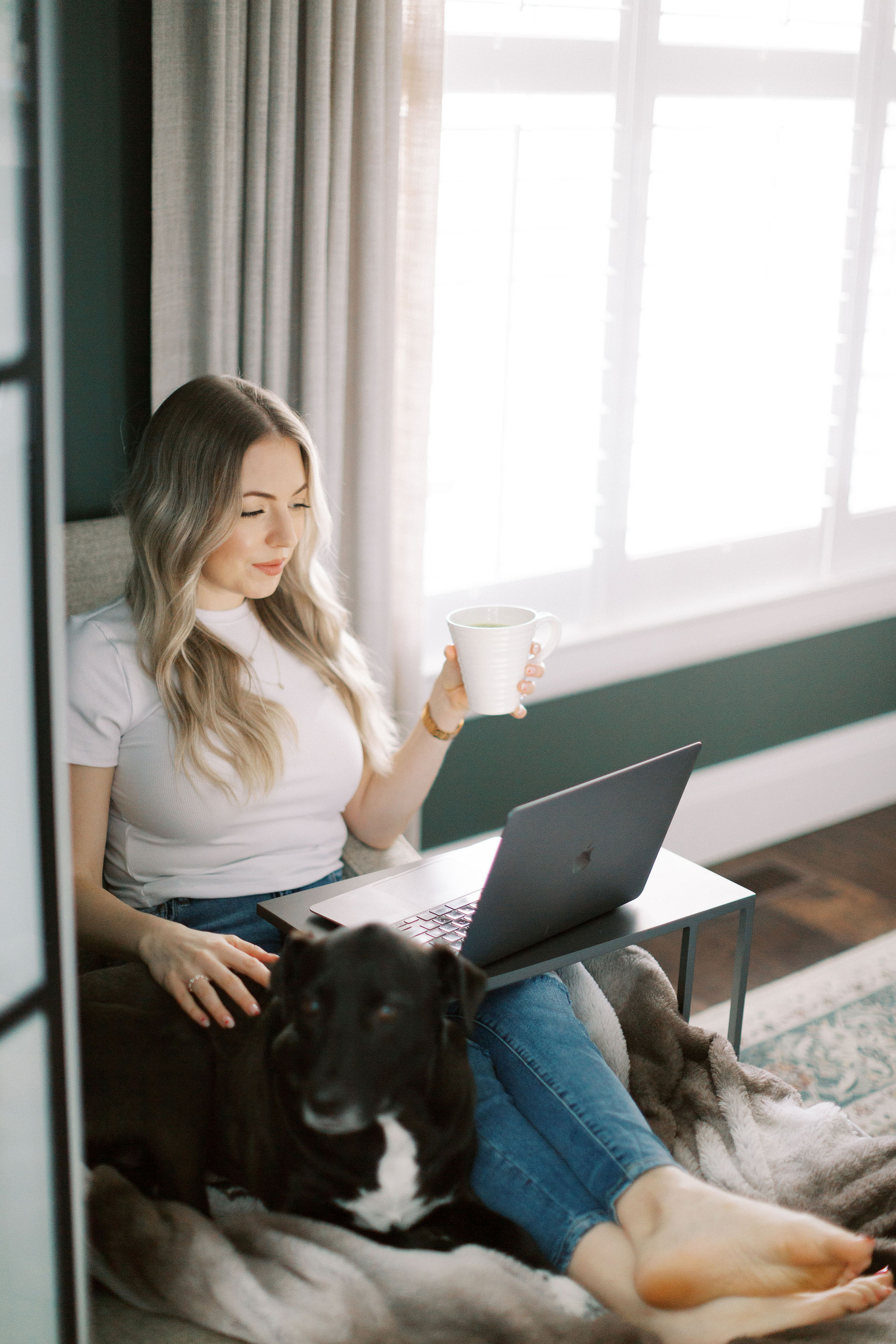 Katie Stewart working from home with her dog